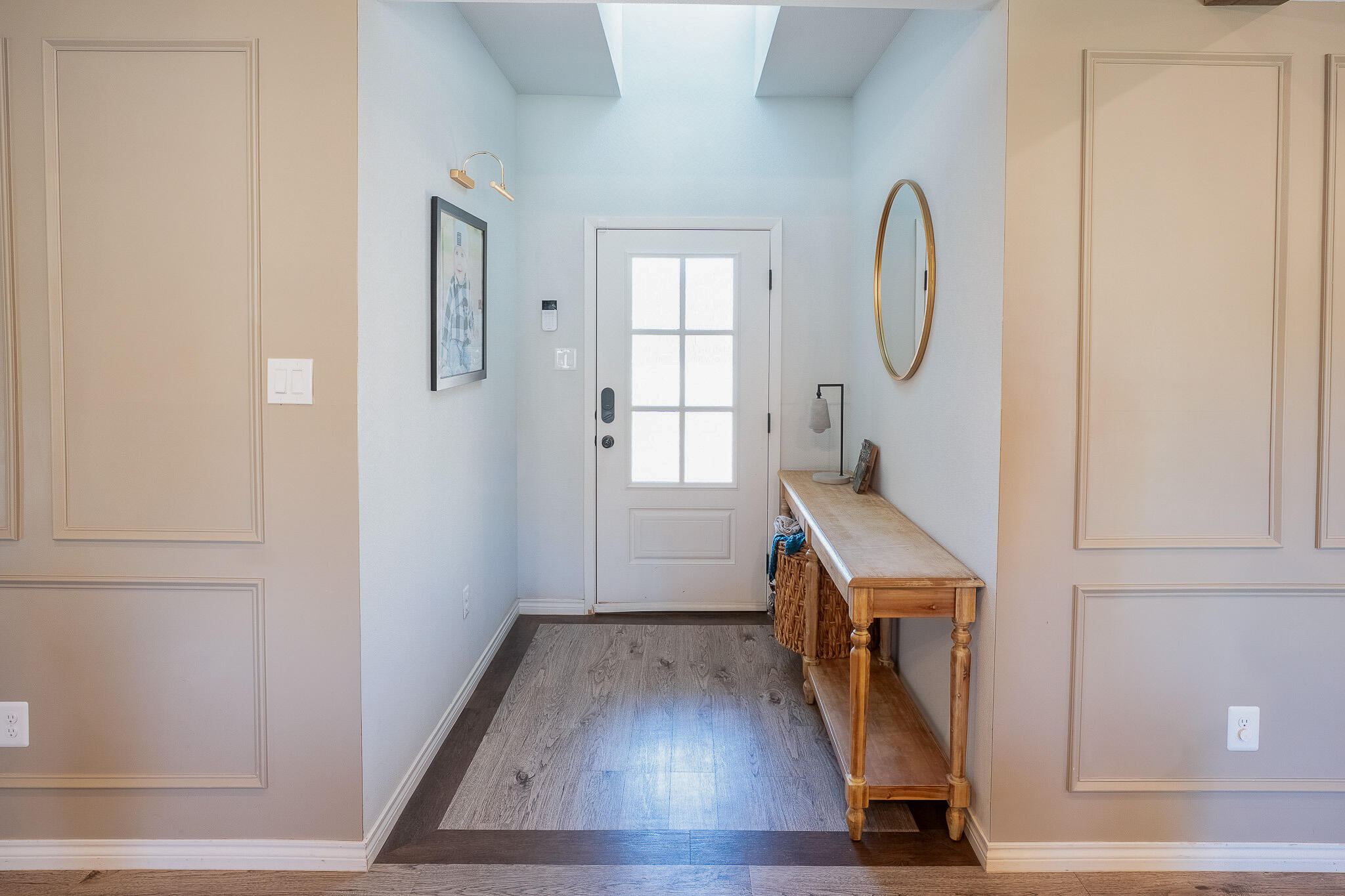 3436 125th Street Lubbock, TX 79423 - Photo 2 of 22 a view of an entryway with wooden floor