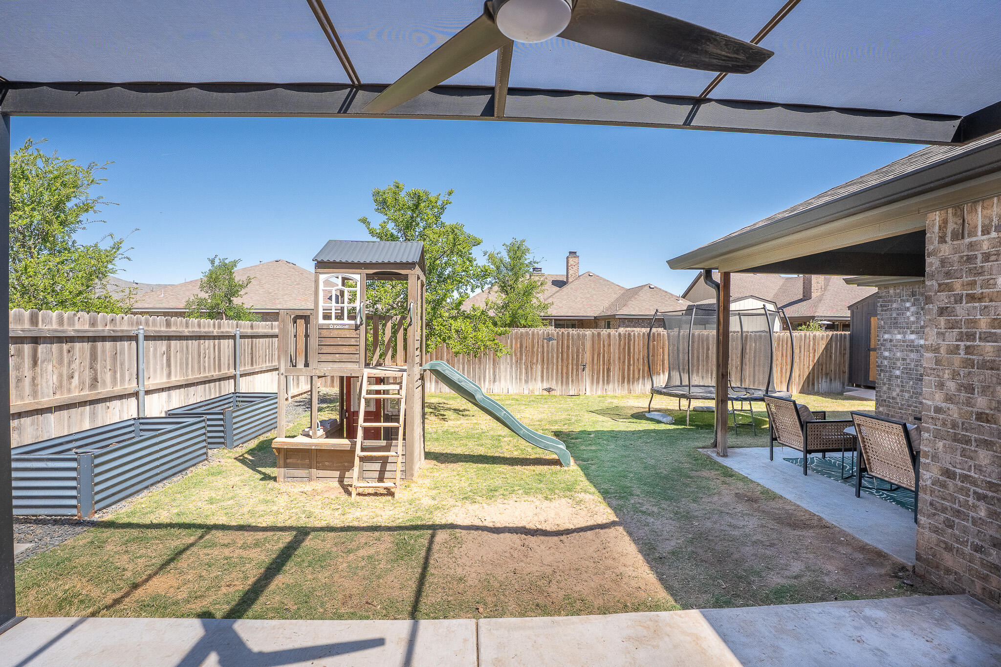 3436 125th Street Lubbock, TX 79423 - Photo 22 of 22 a view of a porch with furniture