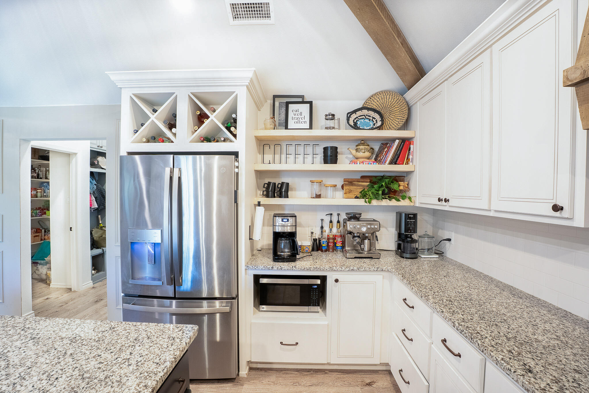 3436 125th Street Lubbock, TX 79423 - Photo 6 of 22 a kitchen with stainless steel appliances granite countertop a refrigerator and a counter space