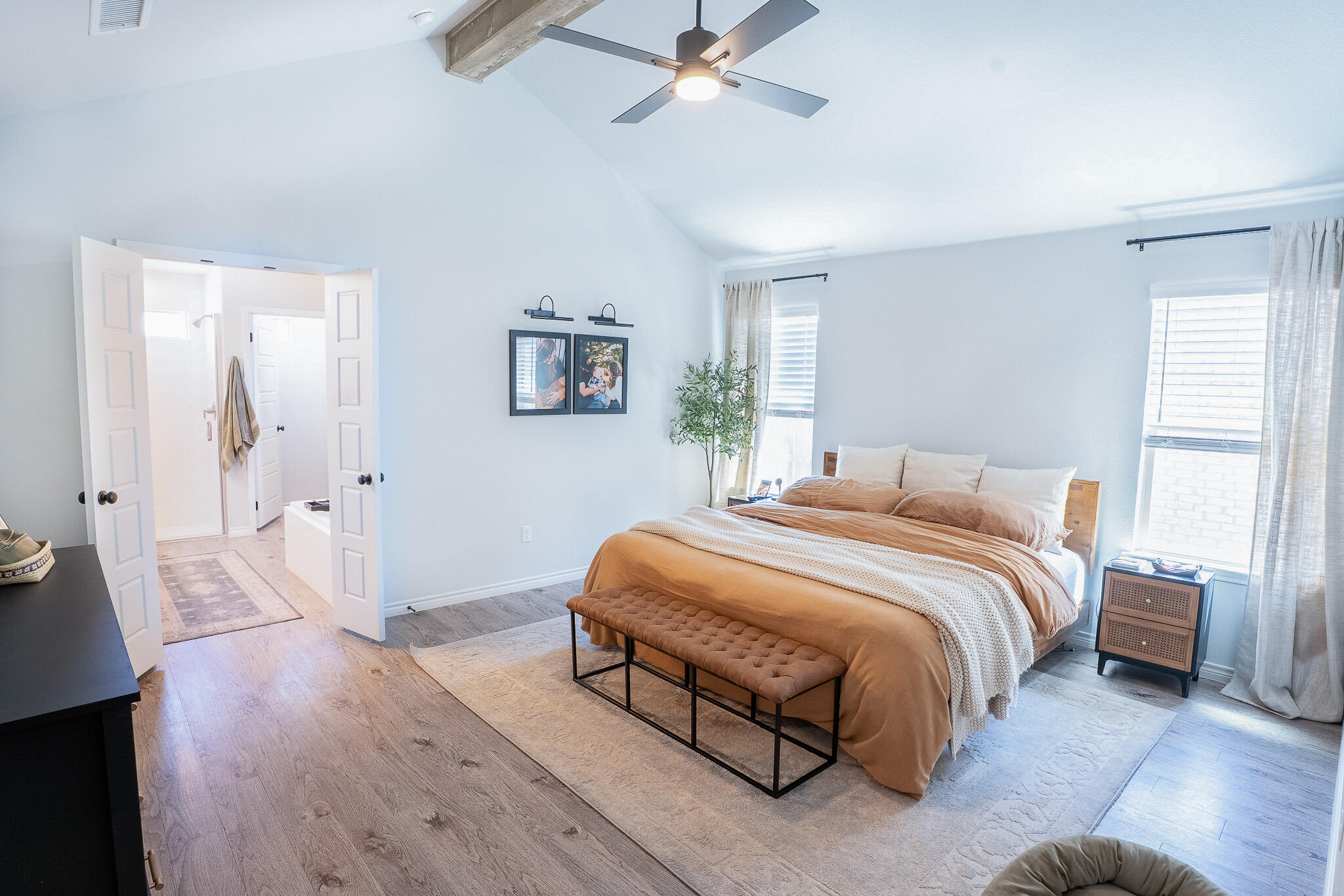 3436 125th Street Lubbock, TX 79423 - Photo 9 of 22 a spacious bedroom with a bed and wooden floor