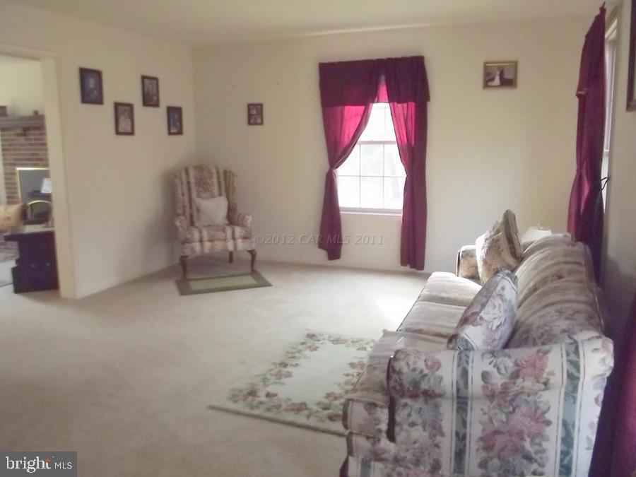 10665 Clarence Barnes Road Princess Anne, MD 21853 - Photo 20 of 21 a bedroom with a bed and a window