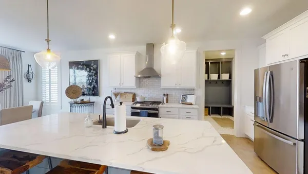 a kitchen with a sink stove and refrigerator