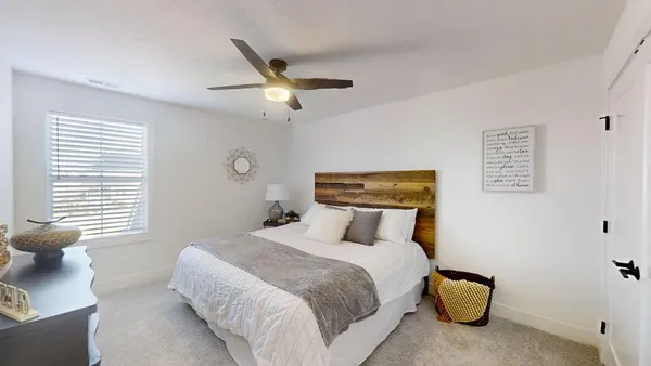 a work room with furniture and a window