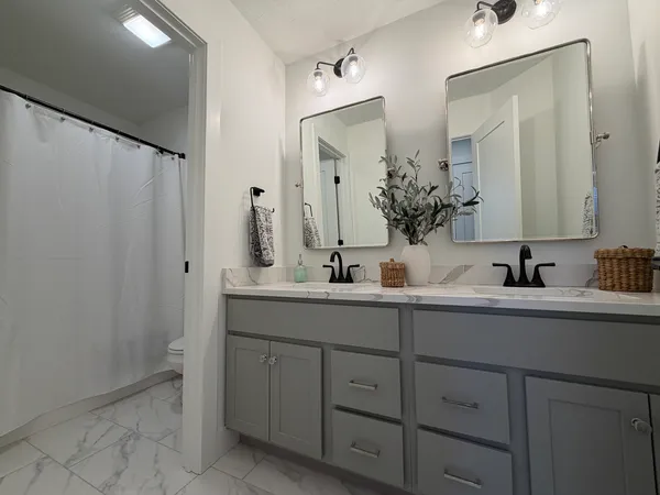 a living room with furniture or couch and a flat screen tv