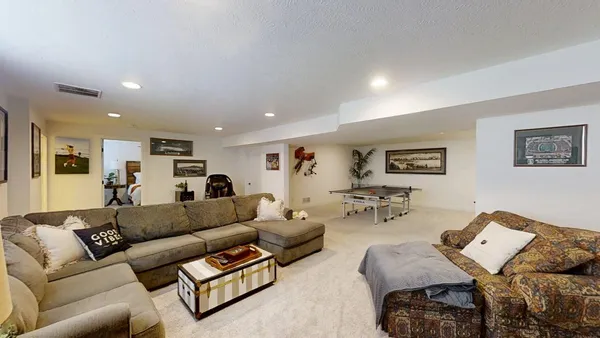a front view of house with yard and outdoor seating