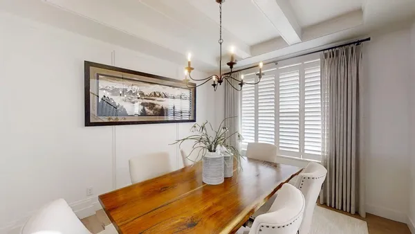 a living room with furniture fireplace and window