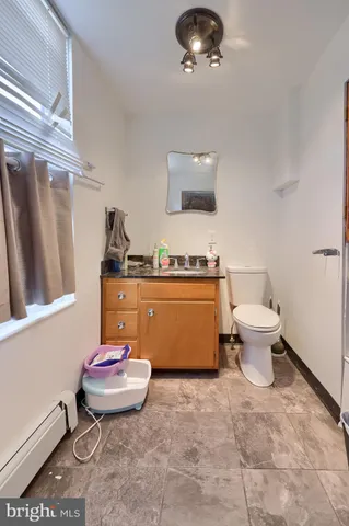 a kitchen with refrigerator and cabinets