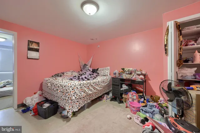 a bathroom with a toilet sink and a mirror