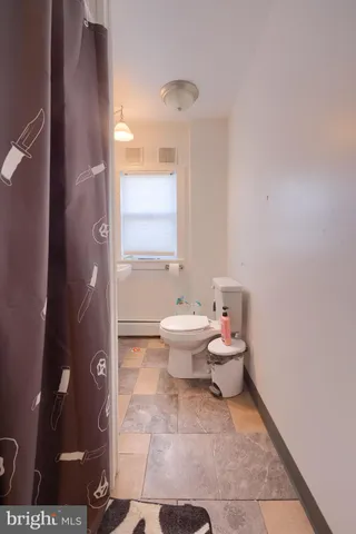 a view of a livingroom with furniture and a chandelier