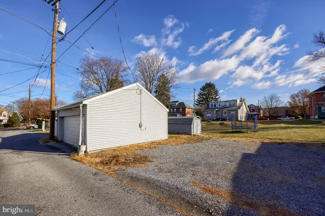 a view of a town with large trees