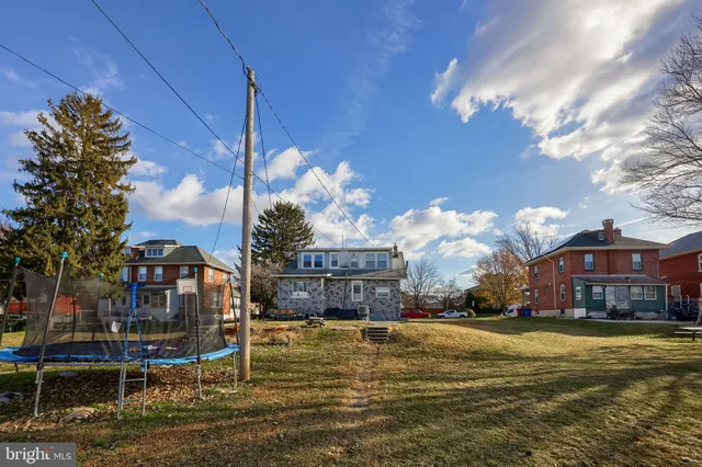 a room with furniture and a baby crib