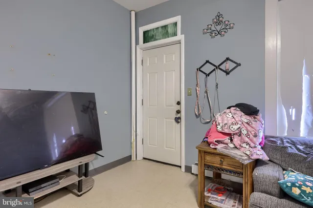 a view of a livingroom with furniture and stairs