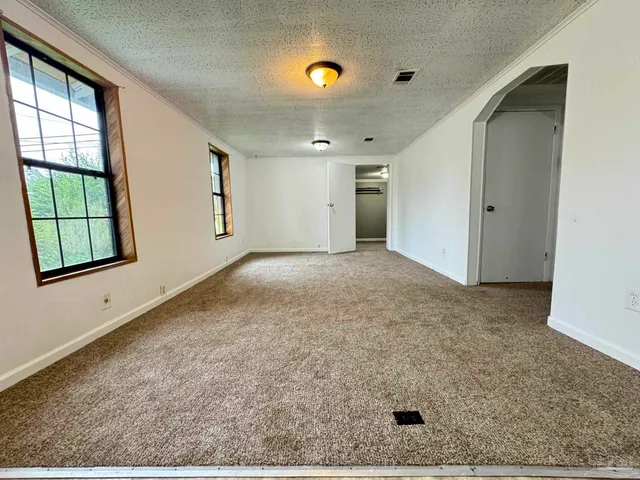 an empty room with windows