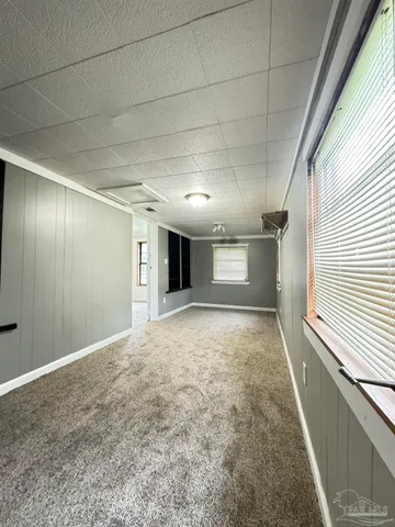 a view of an empty room and a window