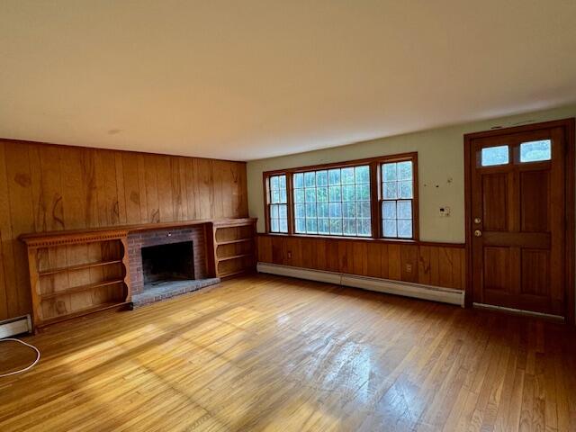 22 Cranberry Lane Centerville, MA 02632 - Photo 2 of 10 a view of an empty room with a window and wooden floor