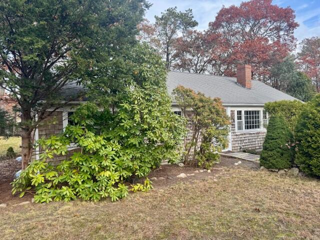 22 Cranberry Lane Centerville, MA 02632 - Photo 8 of 10 front view of a house with a tree