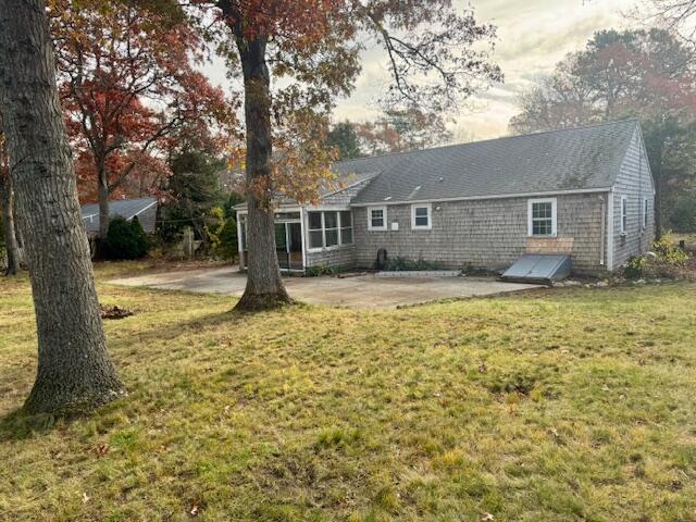 22 Cranberry Lane Centerville, MA 02632 - Photo 9 of 10 a front view of a house with a yard