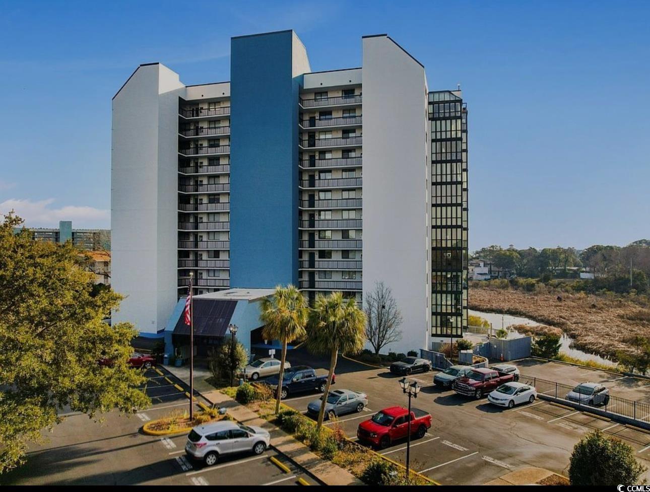 View of building exterior featuring uncovered park