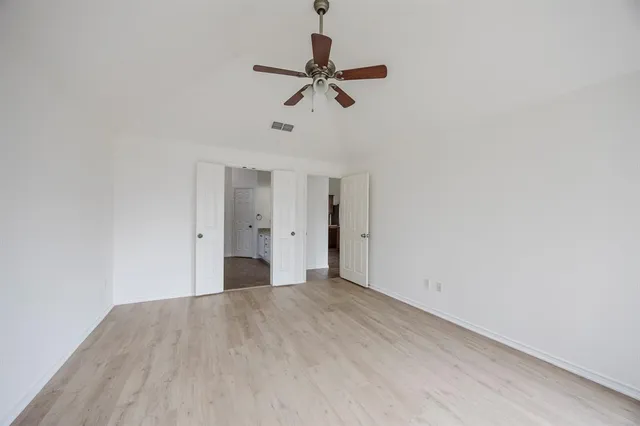 a view of room with a ceiling fan