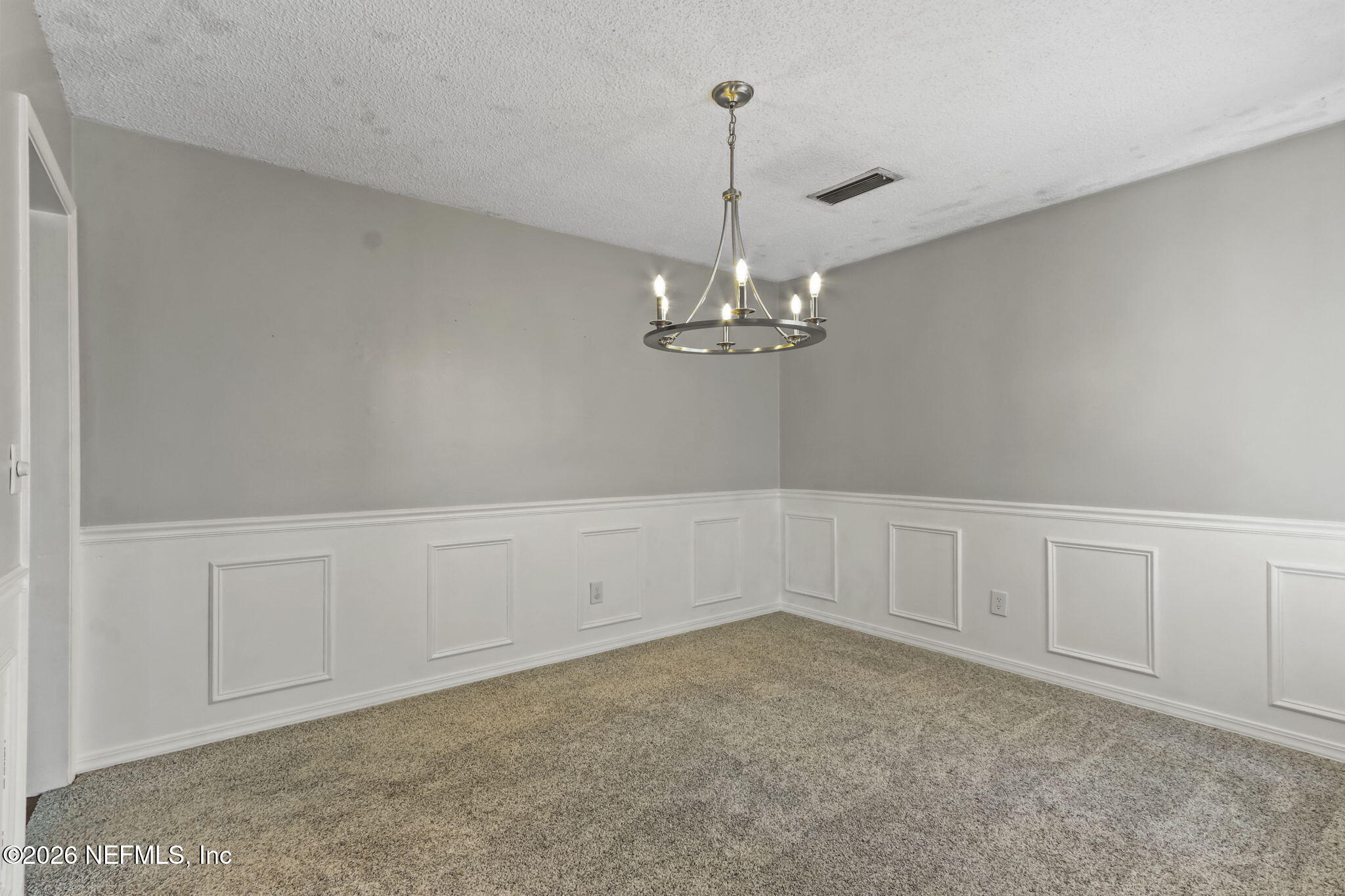 120 Vanderford Road North Orange Park, FL 32073 - Photo 11 of 40 a view of an empty room with chandelier
