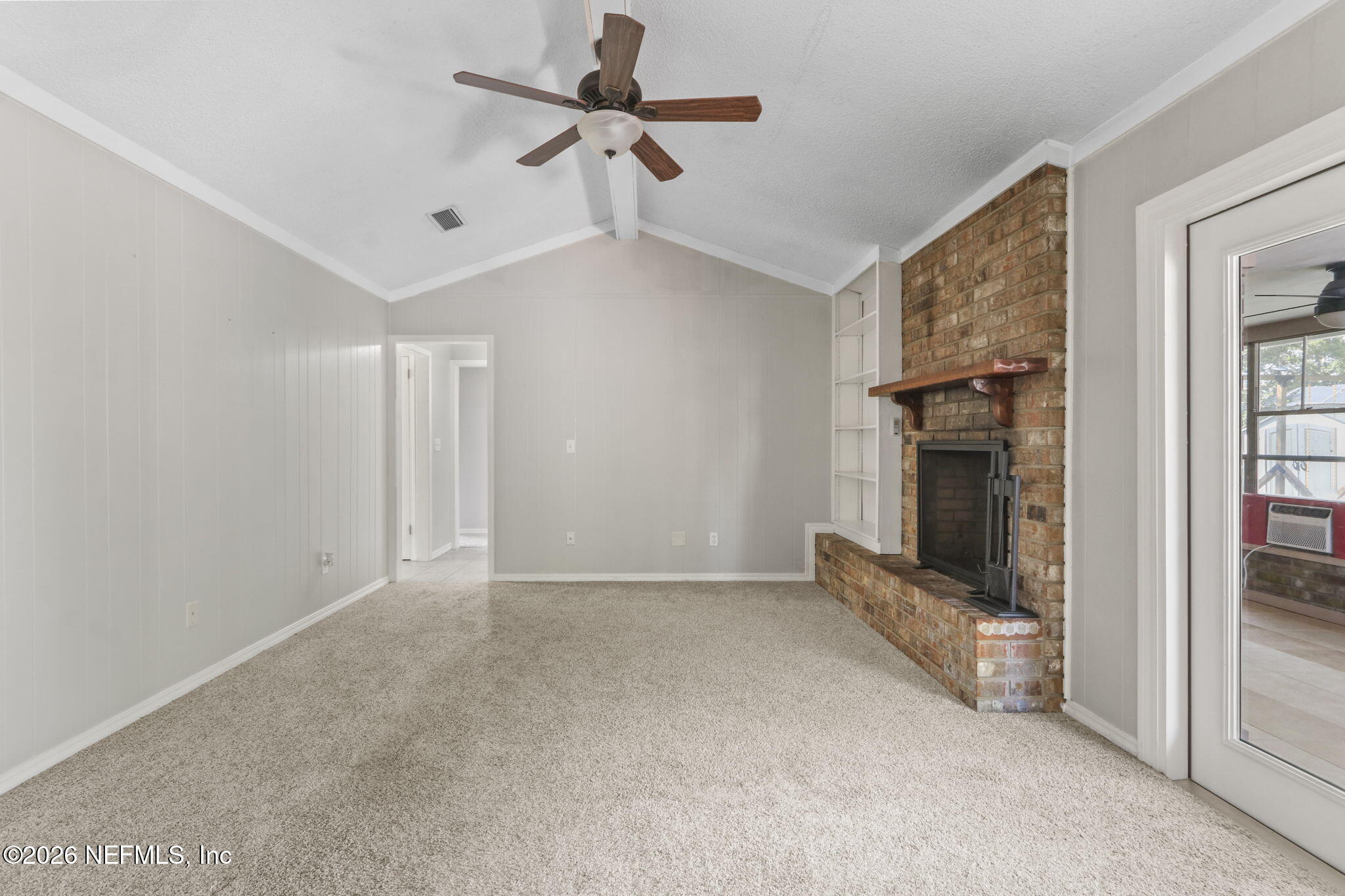 120 Vanderford Road North Orange Park, FL 32073 - Photo 14 of 40 a view of an empty room with a fireplace