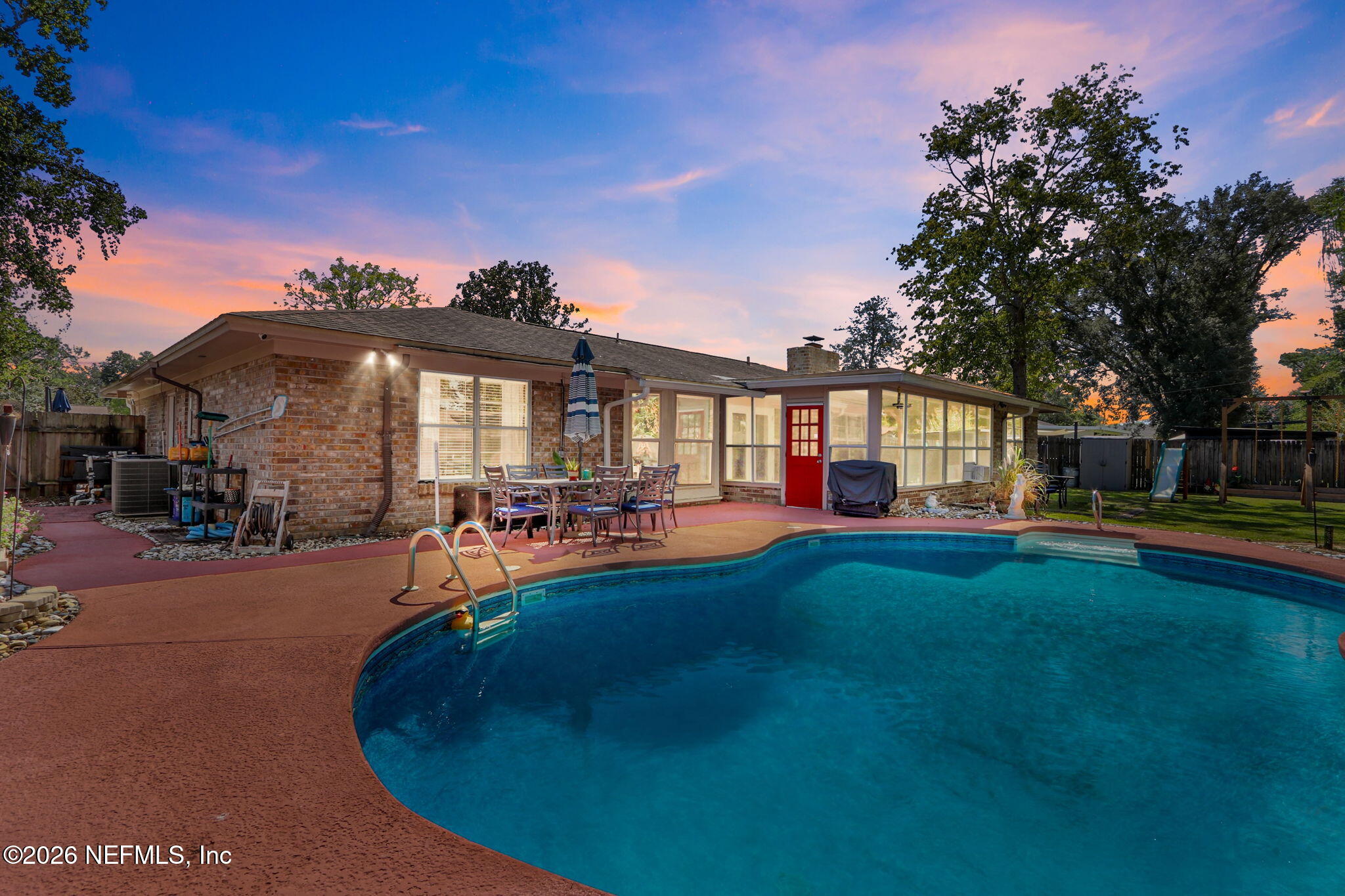 120 Vanderford Road North Orange Park, FL 32073 - Photo 2 of 40 a view of a house with swimming pool and porch