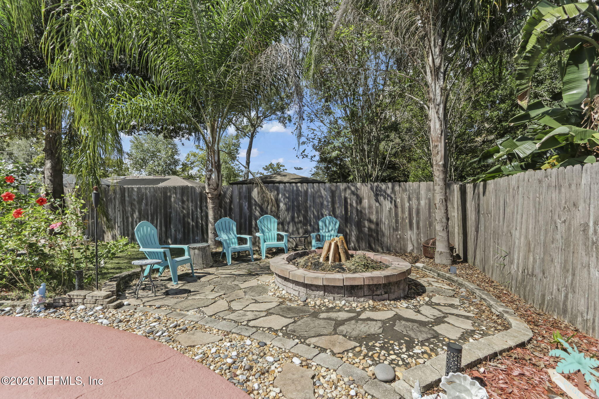 120 Vanderford Road North Orange Park, FL 32073 - Photo 29 of 40 a backyard of a house with a table and chairs