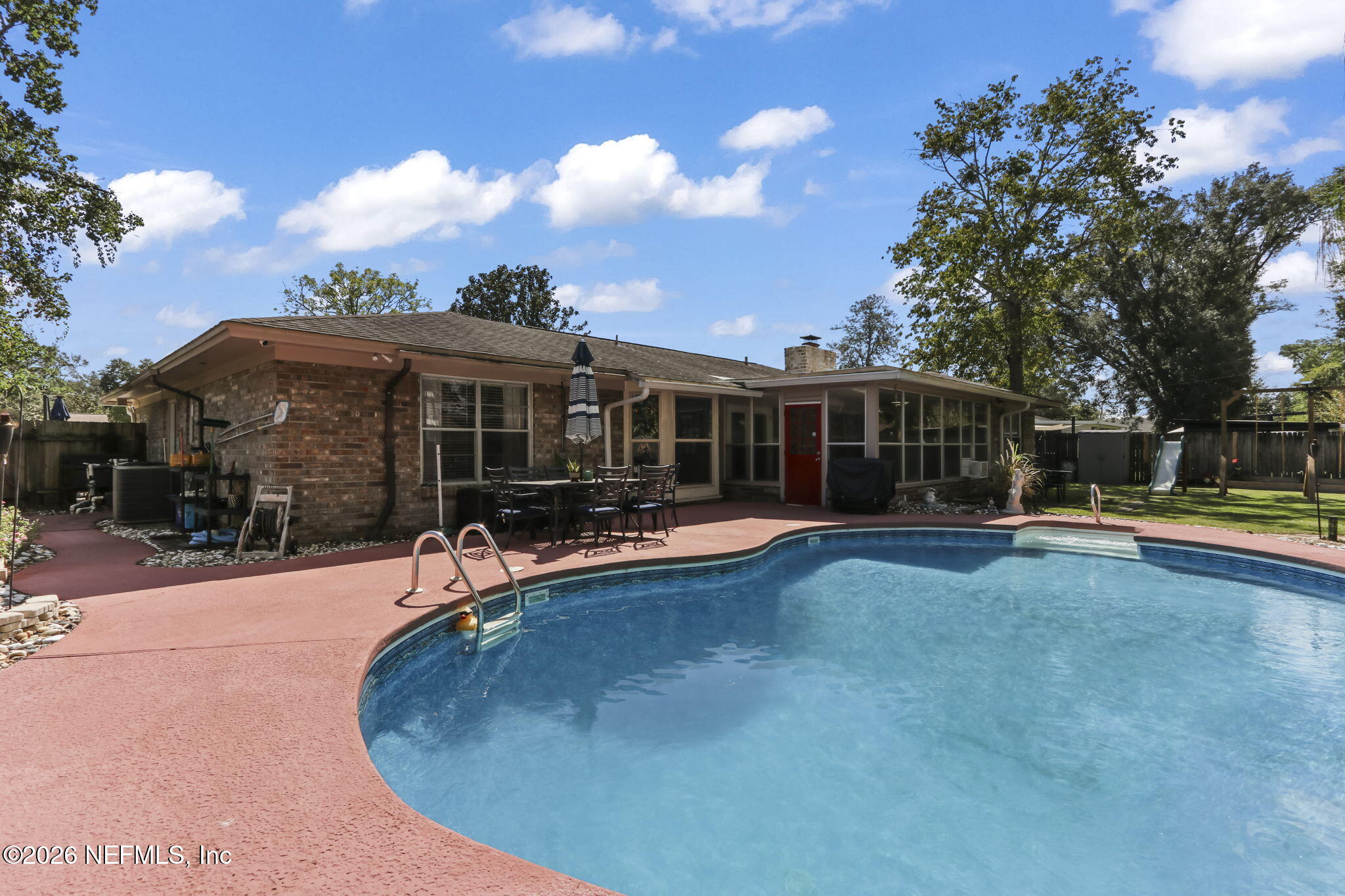 120 Vanderford Road North Orange Park, FL 32073 - Photo 30 of 40 a view of a house with swimming pool and sitting area