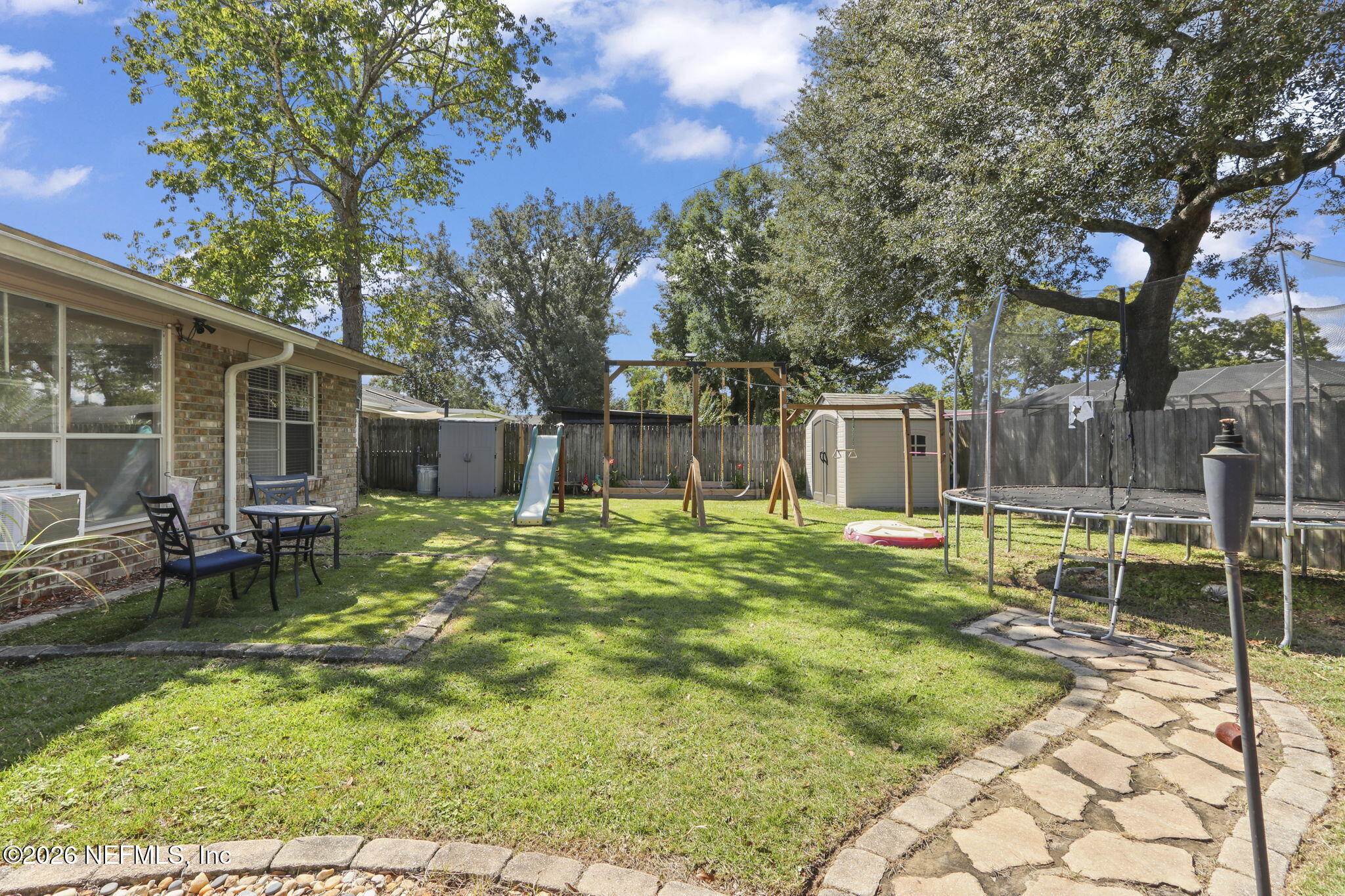 120 Vanderford Road North Orange Park, FL 32073 - Photo 31 of 40 a swimming pool with outdoor seating and yard