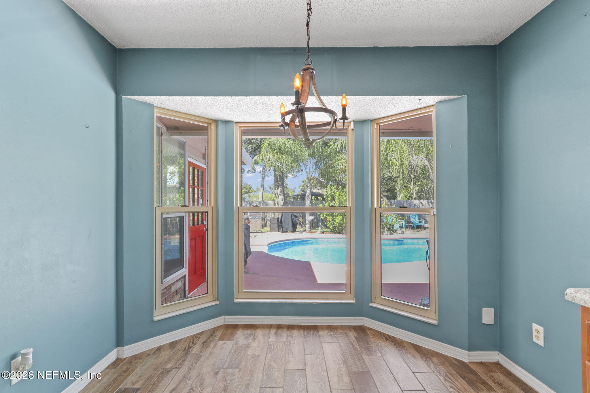 120 Vanderford Road North Orange Park, FL 32073 - Photo 8 of 40 a view of a room that has a bed and wooden floor
