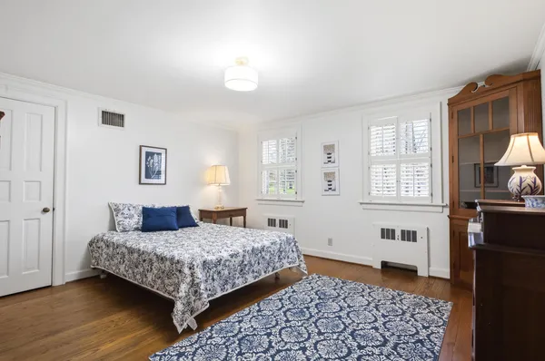 a bedroom with a bed and a table in it