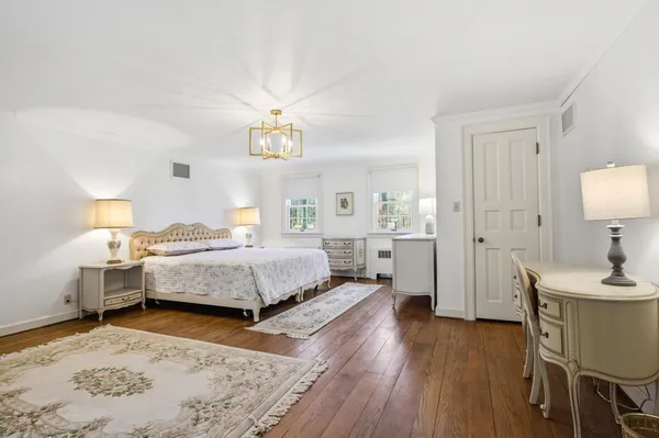 a bedroom with two beds and a window