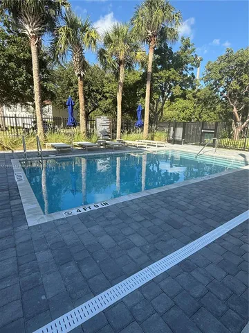 a kitchen with stainless steel appliances a refrigerator sink and microwave