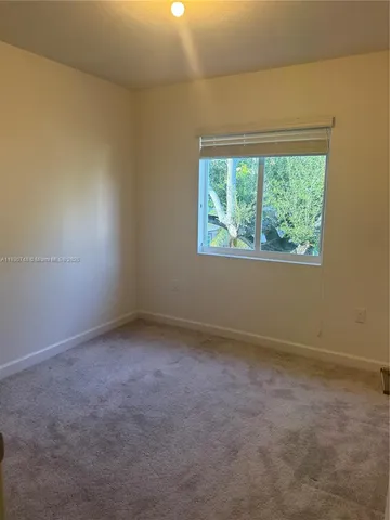 a kitchen with stainless steel appliances granite countertop a sink and a stove