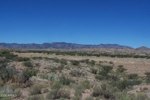 a view of a town with mountains in the background