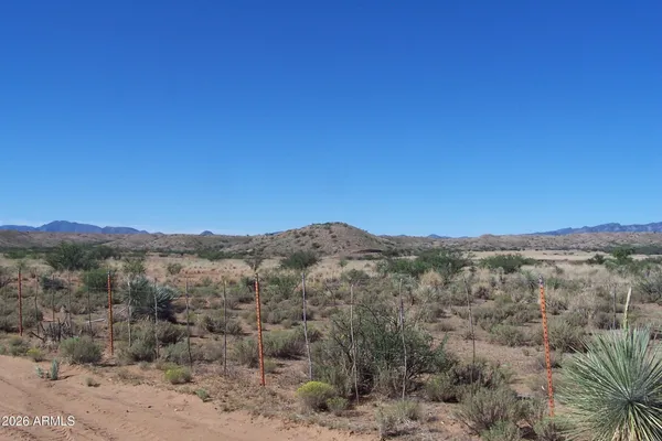 a view of a mountain range in a cloudy sky