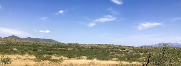 a sign that is on a brick wall