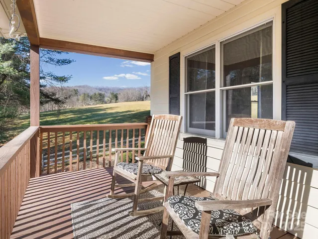 a view of a chairs on wooden deck