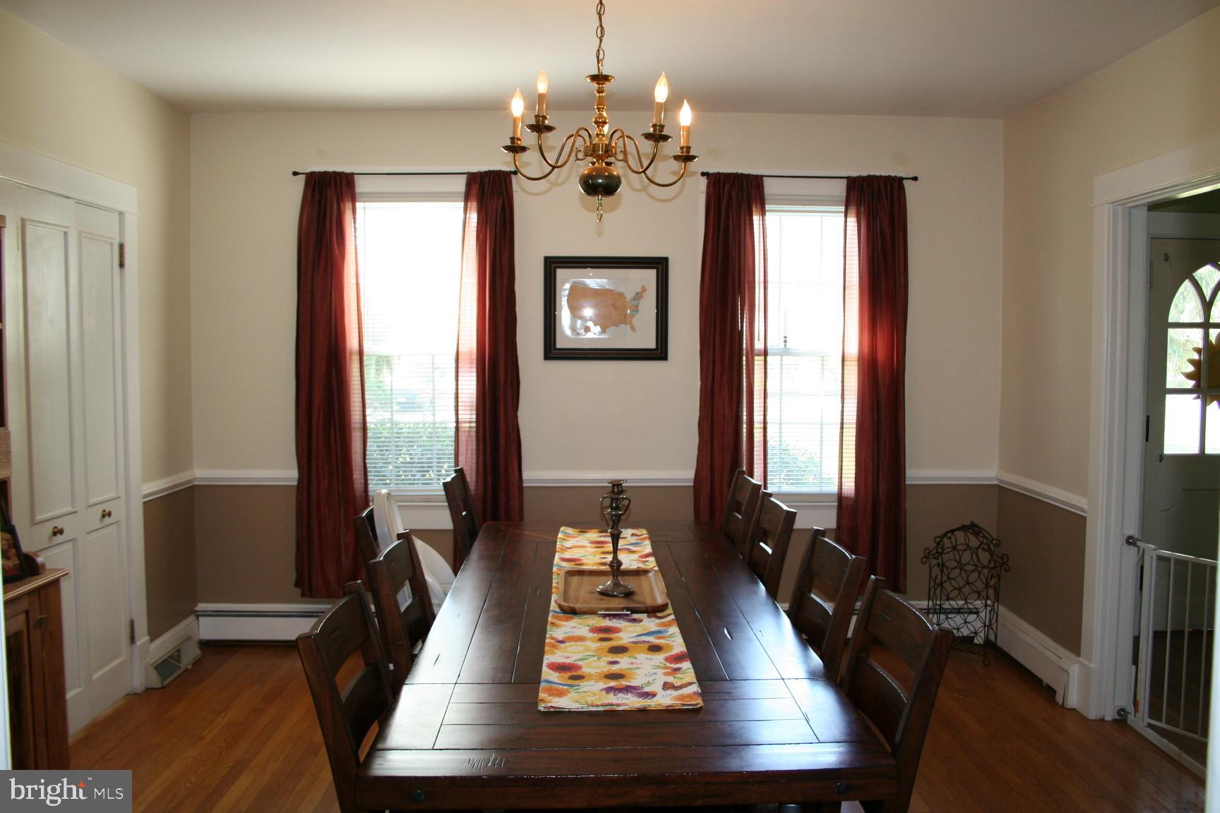 1629 Perryman Road Aberdeen, MD 21001 - Photo 14 of 33 a view of a dining room with furniture a chandelier and wooden floor