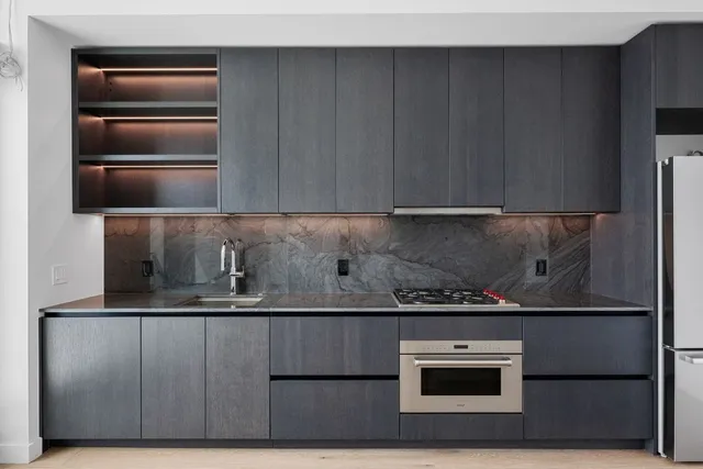 a kitchen with a sink and cabinets