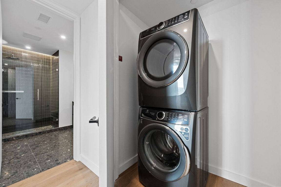 610 Davis Street, Unit 4308 Austin, TX 78701 - Photo 17 of 21 a view of a hallway with washer and dryer