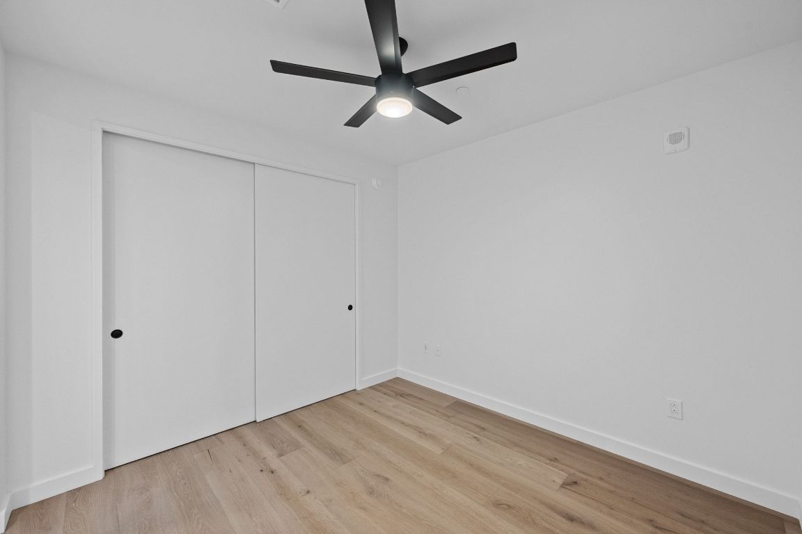 610 Davis Street, Unit 4308 Austin, TX 78701 - Photo 10 of 21 a view of a room with wooden floor