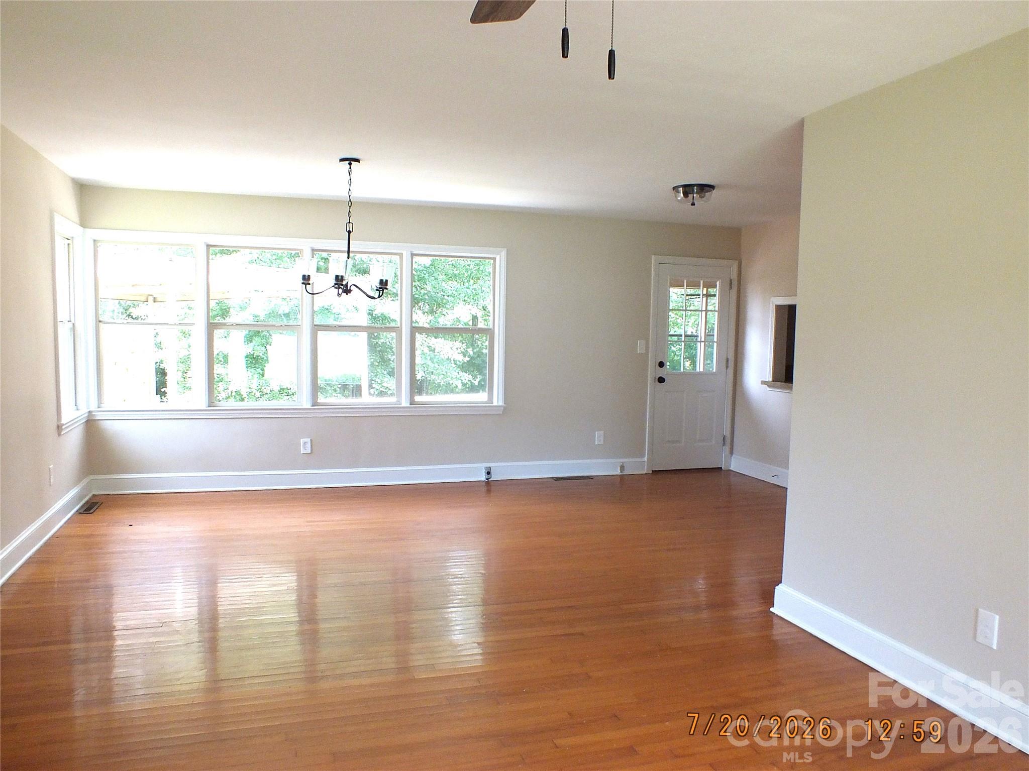 414 West Springs Street Lancaster, SC 29720 - Photo 4 of 22 a view of a room with window wooden floor and front door