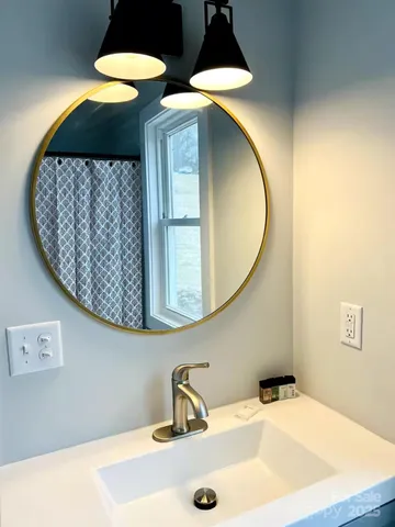 a work room with furniture and a potted plant