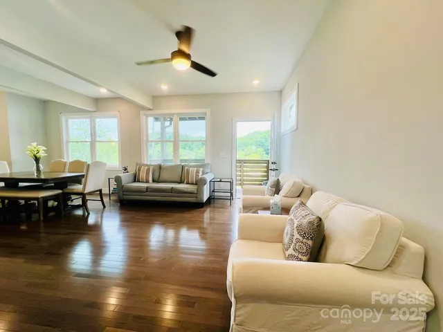 a dining table with chairs and window