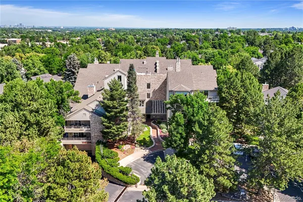 an aerial view of a house with a yard and lake view