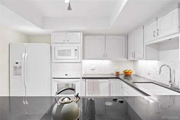 a kitchen with a sink and cabinets