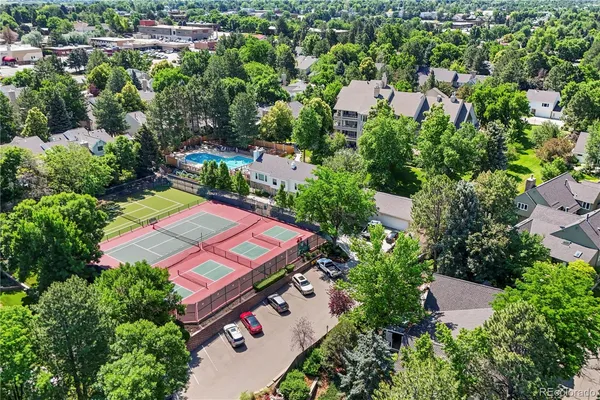 an aerial view of a house with a yard