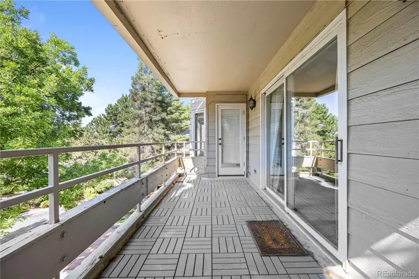 a view of balcony with wooden floor