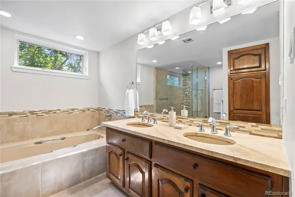 a bathroom with a bathtub and a shower